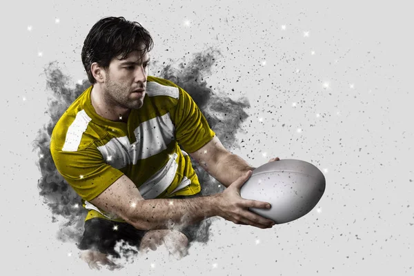 Rugbyspieler kommt aus einer Rauchwolke. — Stockfoto