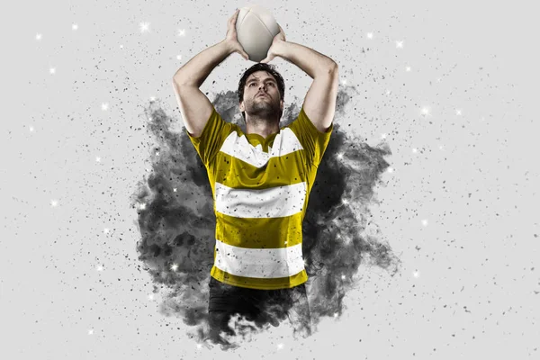 Rugby player coming out of a blast of smoke. — Stock Photo, Image