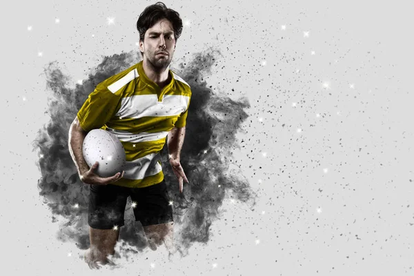 Rugby player coming out of a blast of smoke. — Stock Photo, Image