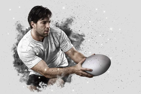 Rugbyspeler coming out van een explosie van rook. — Stockfoto