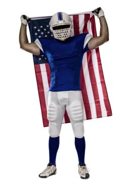 Futbolcu mavi bir üniforma ile