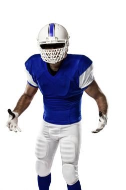 Futbolcu mavi bir üniforma ile