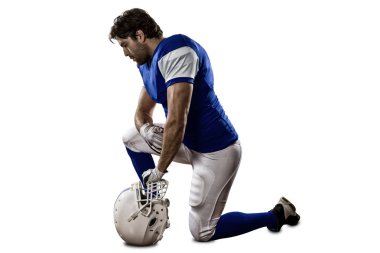 Futbolcu mavi bir üniforma ile