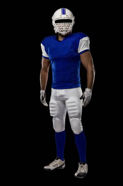 Futbolcu mavi bir üniforma ile
