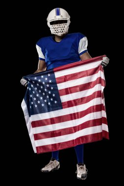 Futbolcu mavi bir üniforma ile