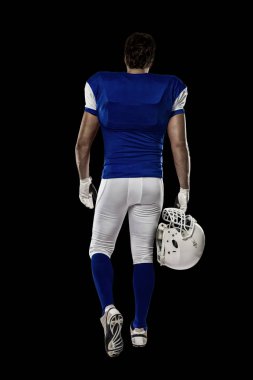 Futbolcu mavi bir üniforma ile