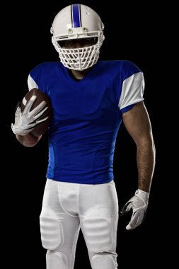 Futbolcu mavi bir üniforma ile