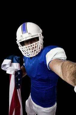 Futbolcu mavi bir üniforma ile