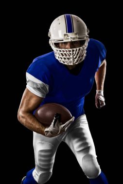 Futbolcu mavi bir üniforma ile