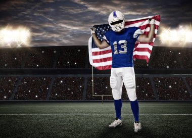 Futbolcu mavi bir üniforma ile