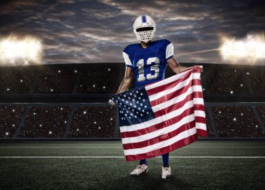 Futbolcu mavi bir üniforma ile