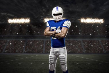 Futbolcu mavi bir üniforma ile