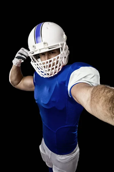 Jogador de futebol com um uniforme azul — Fotografia de Stock