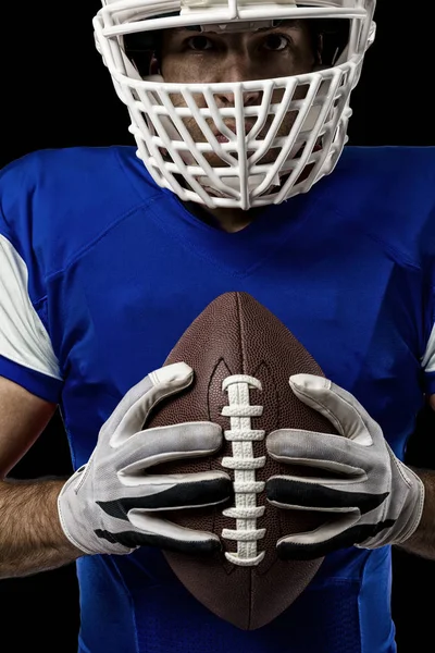 Fotbollsspelare med en blå uniform — Stockfoto