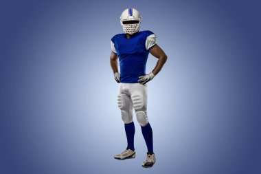 Futbolcu mavi bir üniforma ile