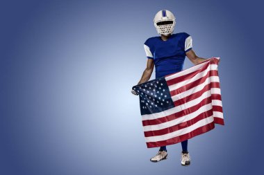 Futbolcu mavi bir üniforma ile