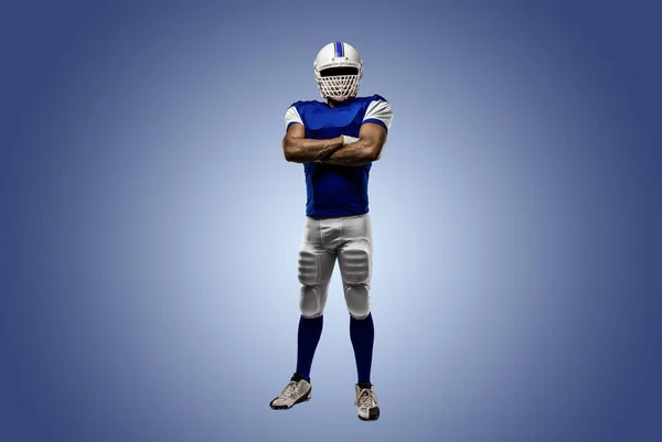 Jogador de futebol com um uniforme azul — Fotografia de Stock