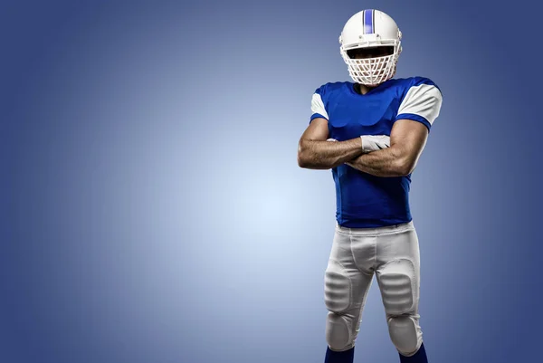 Jogador de futebol com um uniforme azul — Fotografia de Stock