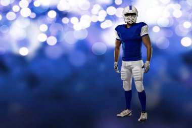 Futbolcu mavi bir üniforma ile