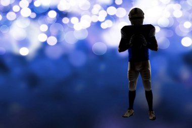 Futbolcu mavi bir üniforma ile