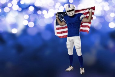 Futbolcu mavi bir üniforma ile