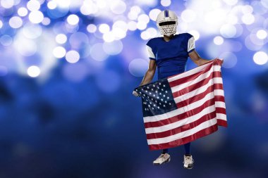 Futbolcu mavi bir üniforma ile