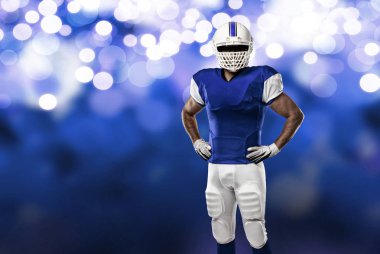 Futbolcu mavi bir üniforma ile