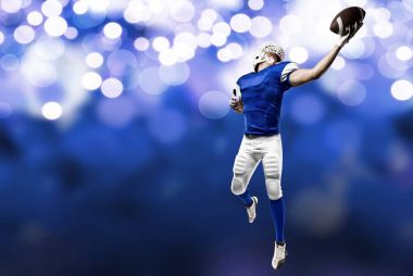 Futbolcu mavi bir üniforma ile