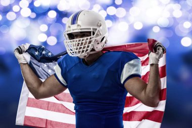 Futbolcu mavi bir üniforma ile