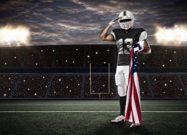 Futbolcu siyah üniforma ile