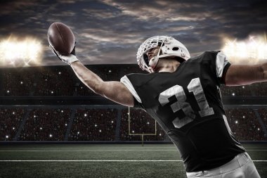 Football Player with a Black uniform clipart