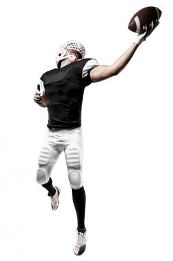 Futbolcu siyah üniforma ile