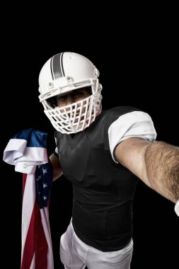 Futbolcu siyah üniforma ile