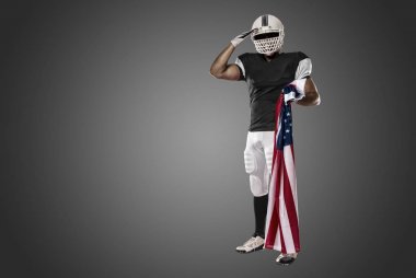 Futbolcu siyah üniforma ile