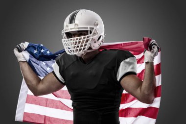 Futbolcu siyah üniforma ile