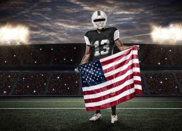 Futbolcu siyah üniforma ile