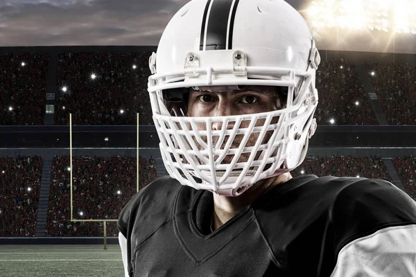 Jugador de fútbol con uniforme negro — Foto de Stock