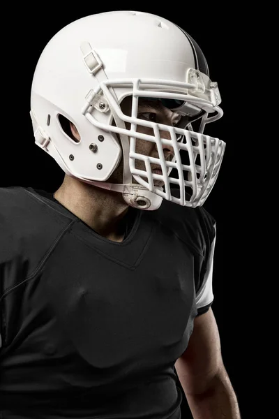 Jogador de futebol com um uniforme preto — Fotografia de Stock