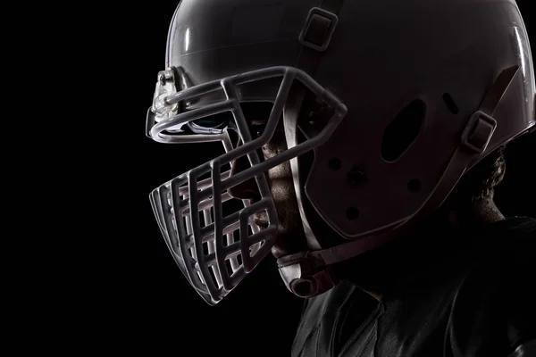 Jogador de futebol com um uniforme preto — Fotografia de Stock