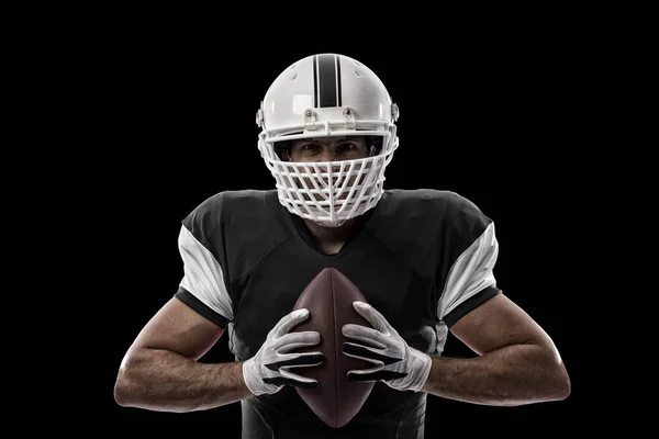 Jogador de futebol com um uniforme preto — Fotografia de Stock