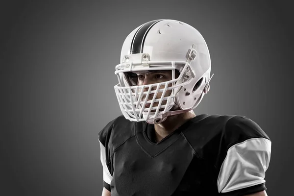 黒い制服のフットボール選手 — ストック写真