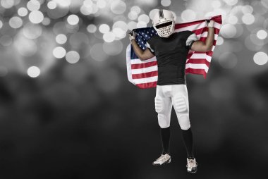 Futbolcu siyah üniforma ile