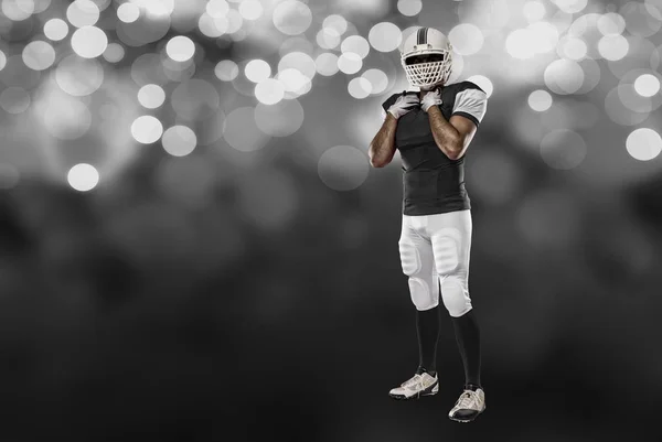 Voetballer met een zwart uniform — Stockfoto