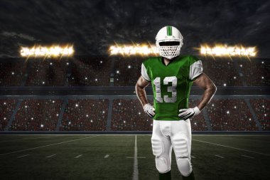 Futbolcu yeşil üniforma ile