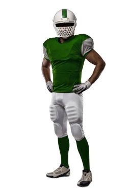 Futbolcu yeşil üniforma ile