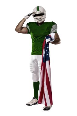 Futbolcu yeşil üniforma ile