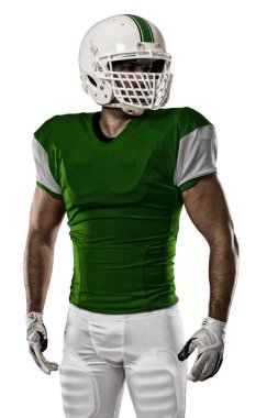 Futbolcu yeşil üniforma ile