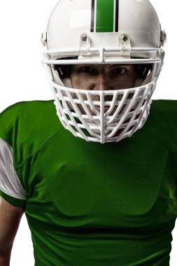 Futbolcu yeşil üniforma ile