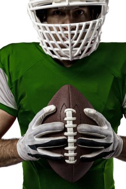 Futbolcu yeşil üniforma ile