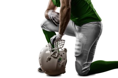 Futbolcu yeşil üniforma ile